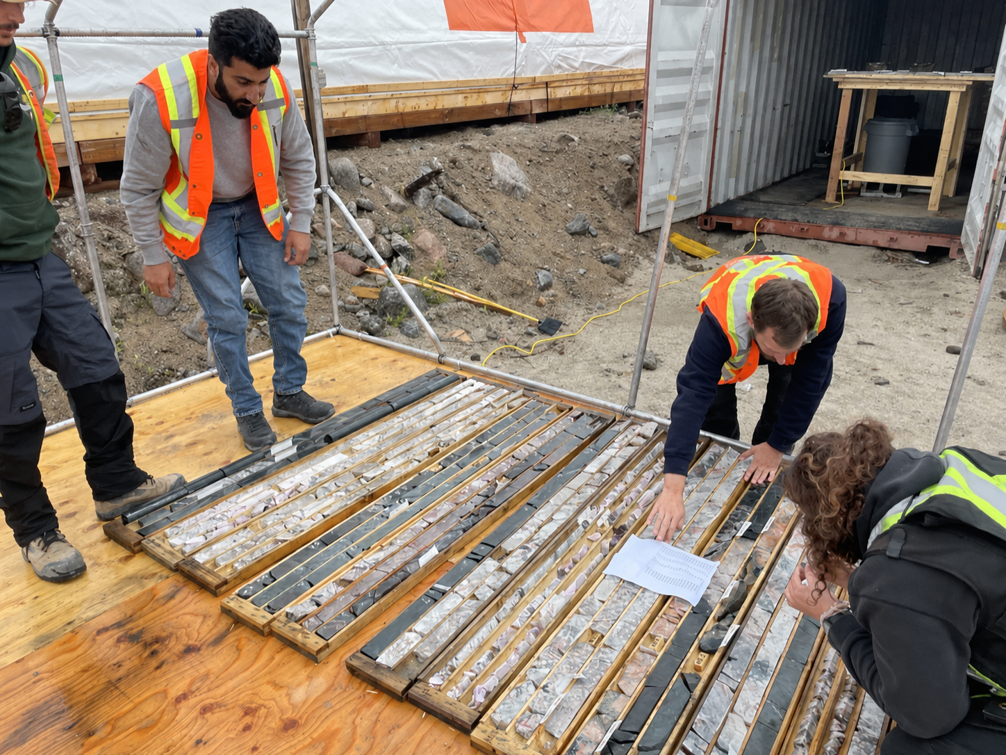 A WhiteRock geologist logging spodumene-bearing drill core from the Banana Lithium Project